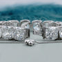 Silver bracelet with large gemstones on a light blue background