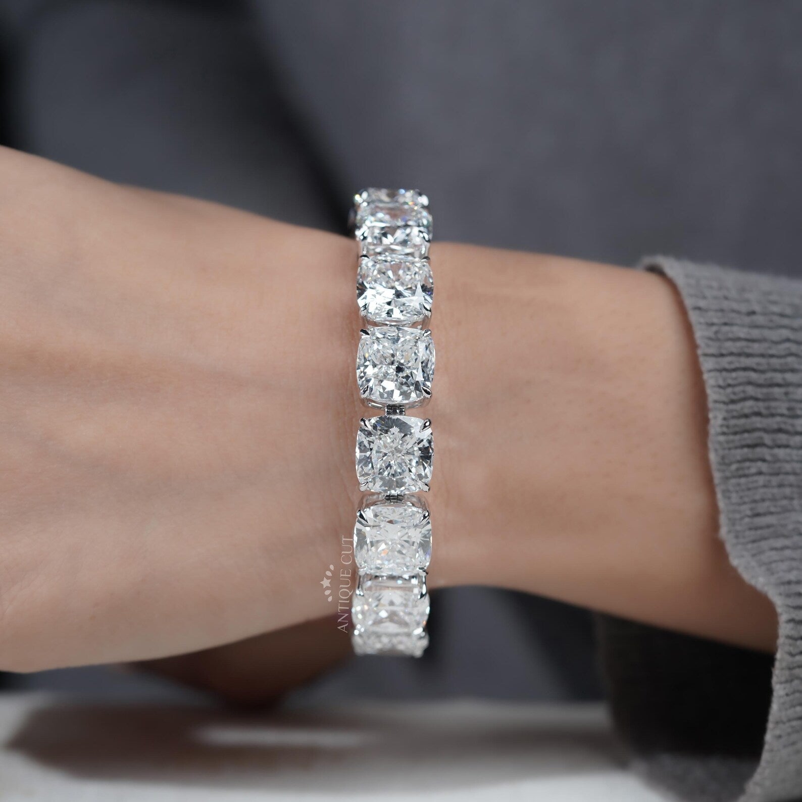 Silver bracelet with large gemstones on a light blue background