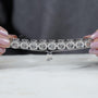 Silver bracelet with large gemstones on a light blue background