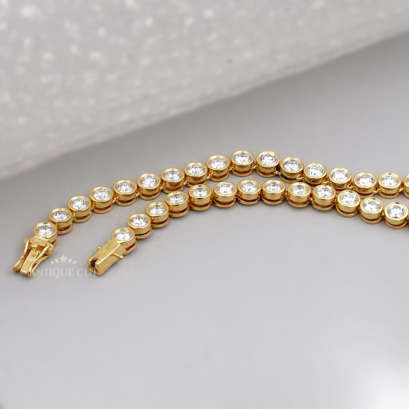 Gold necklace with diamonds on a person's neck