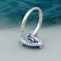 IGI certified blue diamond engagement ring with three round prongs