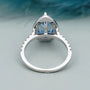 Teardrop shaped halo diamond ring with pave diamond band