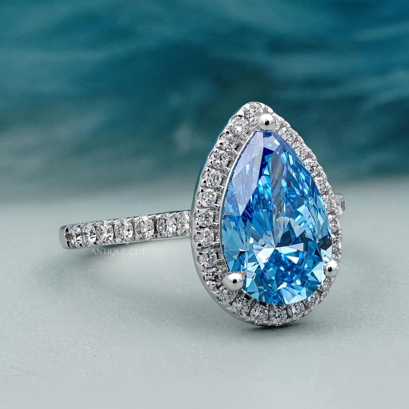 Fancy Blue Diamond Pear Ring | Halo Engagement Ring With Pave Band | IGI Certified