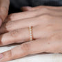 Round diamond eternity band in yellow gold