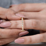 Yellow gold diamond wedding band with round cut stones