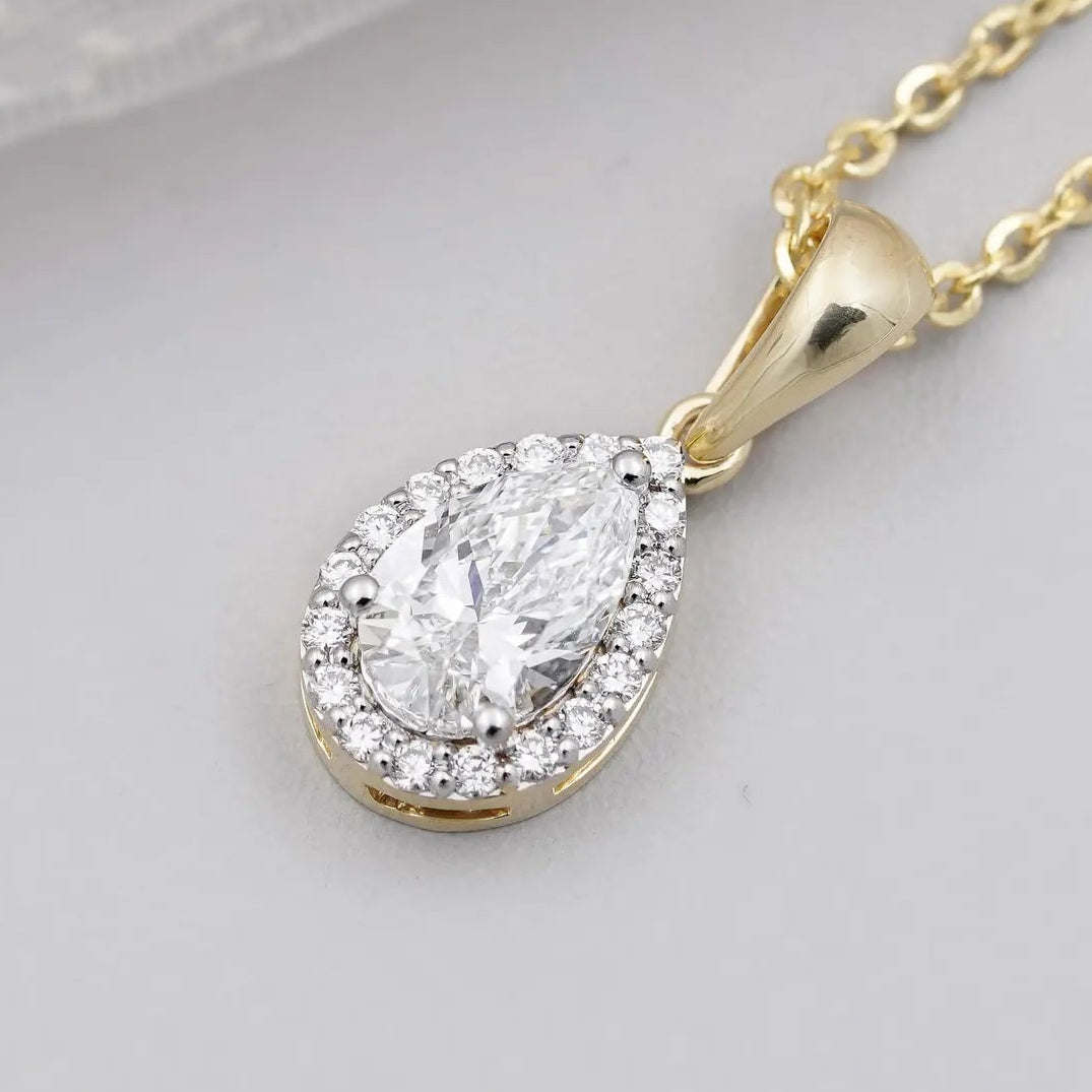 Pear cut pendant with round cut halo setting