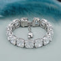 Silver bracelet with large gemstones on a light blue background