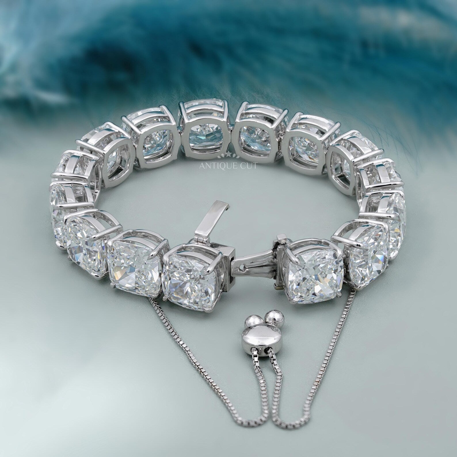 Silver bracelet with large gemstones on a light blue background