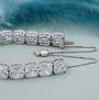 Silver bracelet with large gemstones on a light blue background