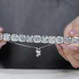 Silver bracelet with large gemstones on a light blue background