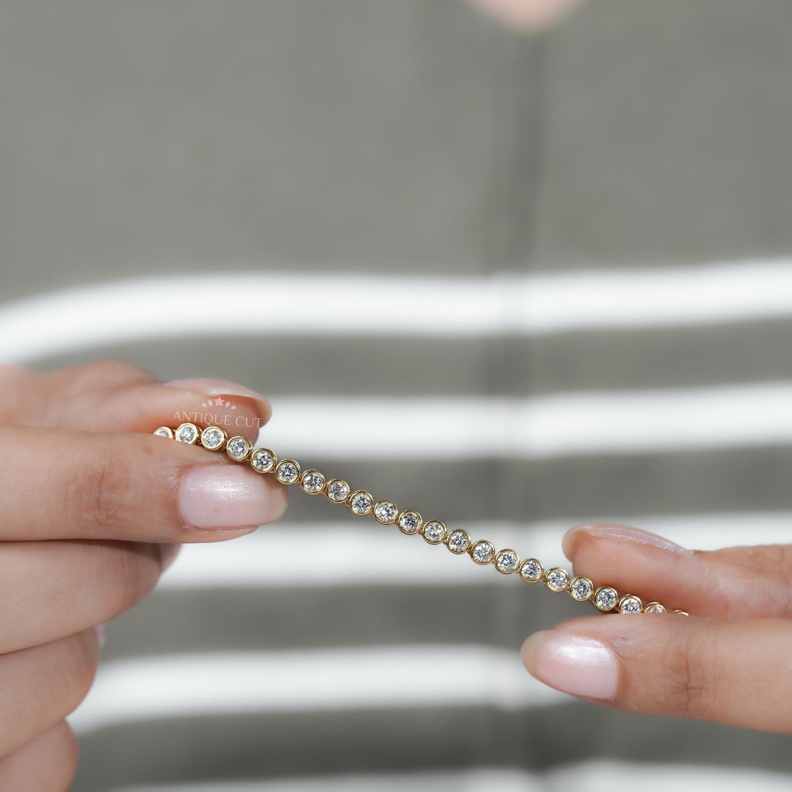 Gold necklace with diamonds on a person's neck