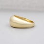 Gold ring on a light gray background

