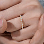 Round brilliant diamond eternity ring with shared prong setting