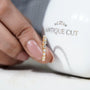 Round diamond wedding band with shared prong setting
