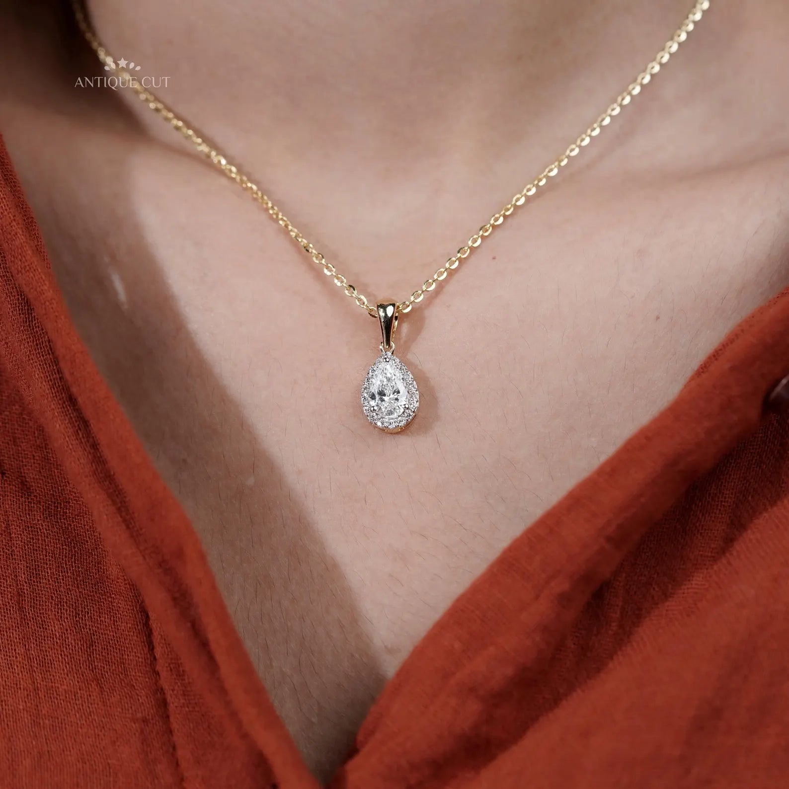 Pear shaped diamond pendant with three prong mount