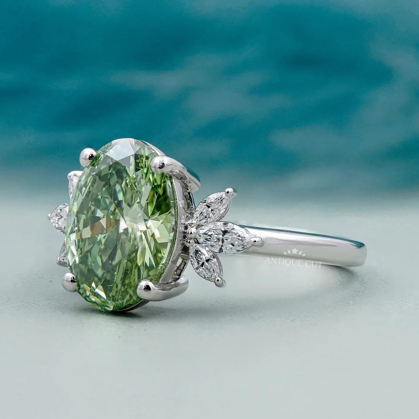 Oval Cut Antique Green Diamond Ring With Marquise Side Stones