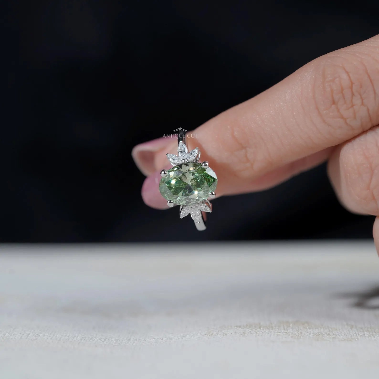Oval Cut Antique Green Diamond Ring With Marquise Side Stones