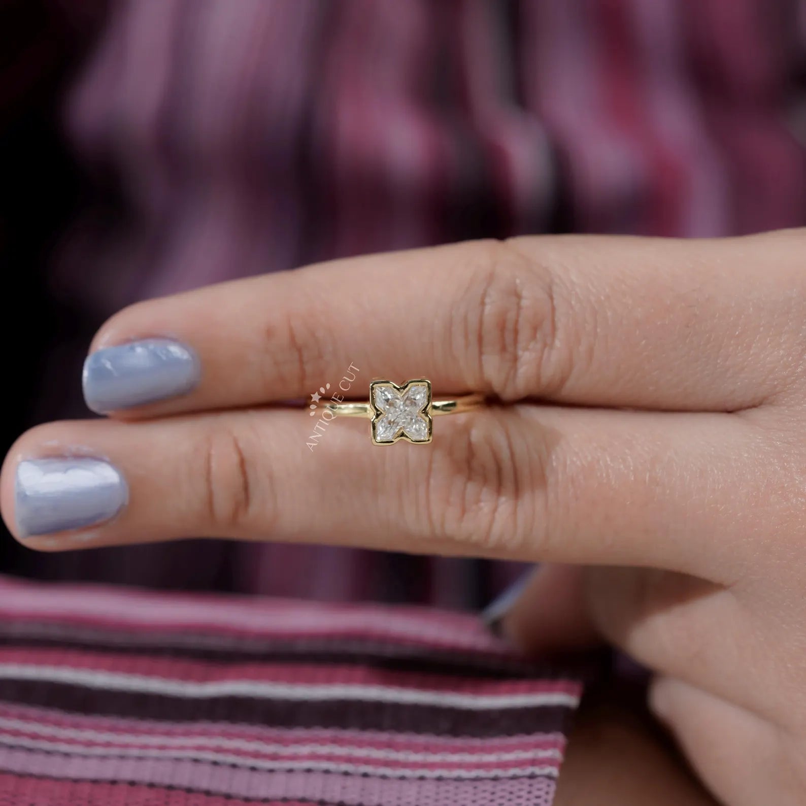 X Shaped Diamond Ring with bezel setting in yellow gold
