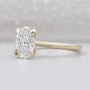 Oval solitaire diamond ring with hidden halo
