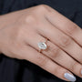 Oval center diamond ring with pavé rose gold band