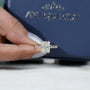 Cushion cut diamond ring with pavé band and double claw prongs in yellow gold