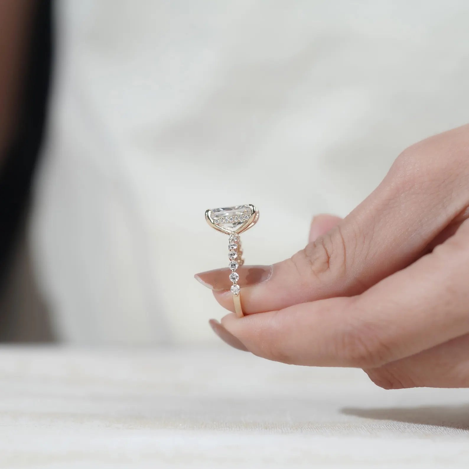 Radiant cut lab grown diamond ring with claw prongs and pavé accented yellow gold band