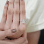 Antiquecut radiant cut engagement ring with hidden halo and pavé diamond setting