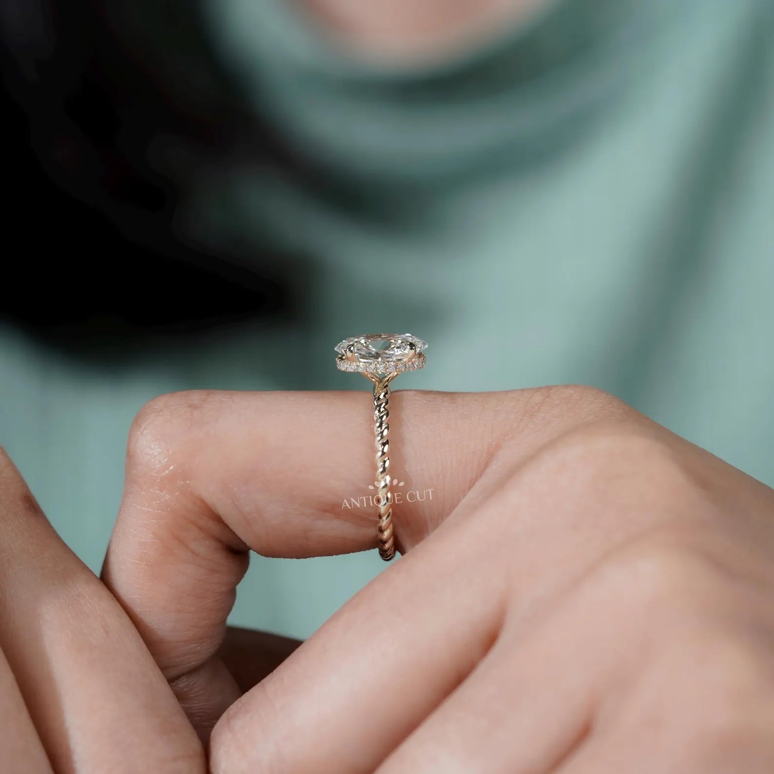 Hidden Halo Oval Cut Engagement Ring with Twisted Gold Band