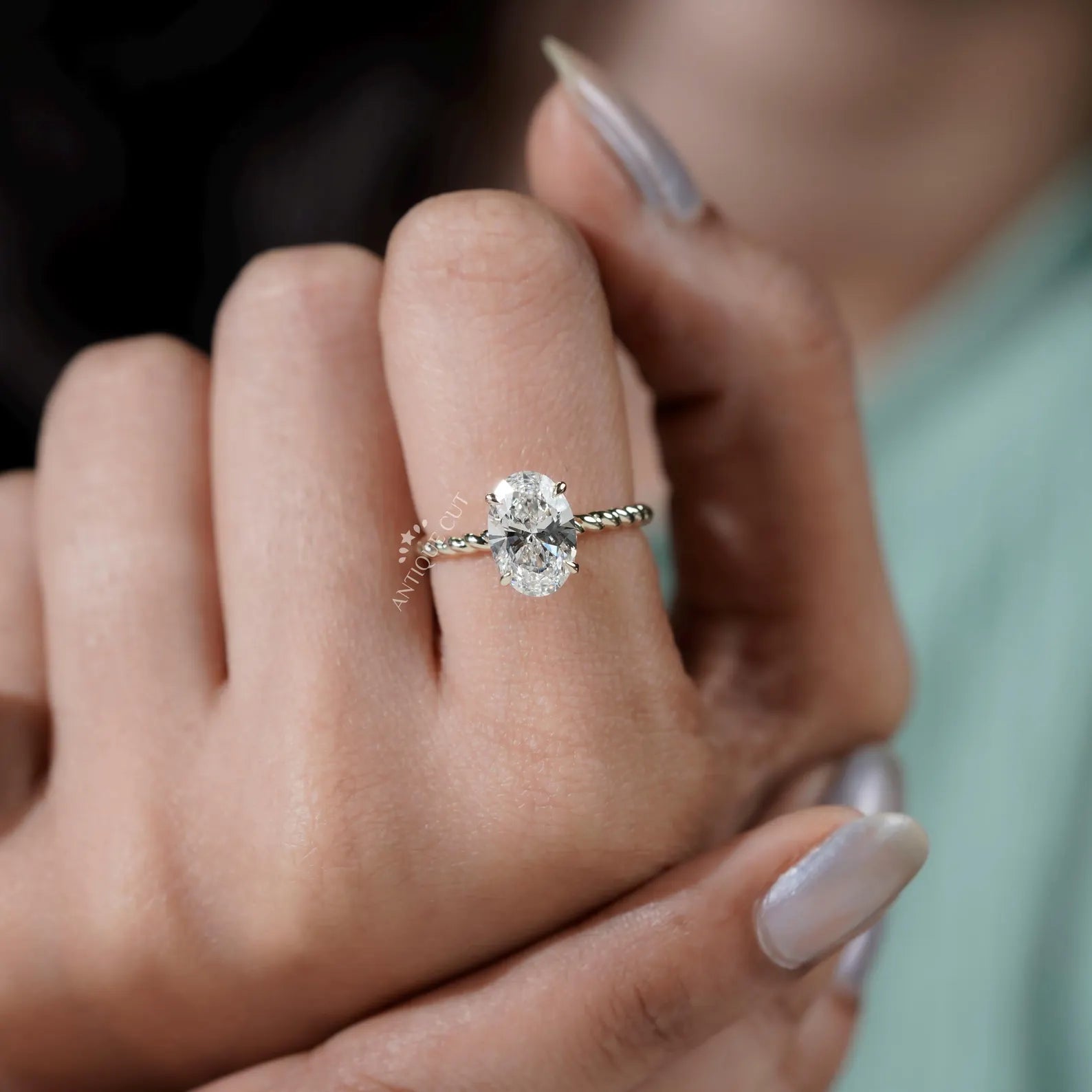 Hidden Halo Oval Cut Engagement Ring with Twisted Gold Band