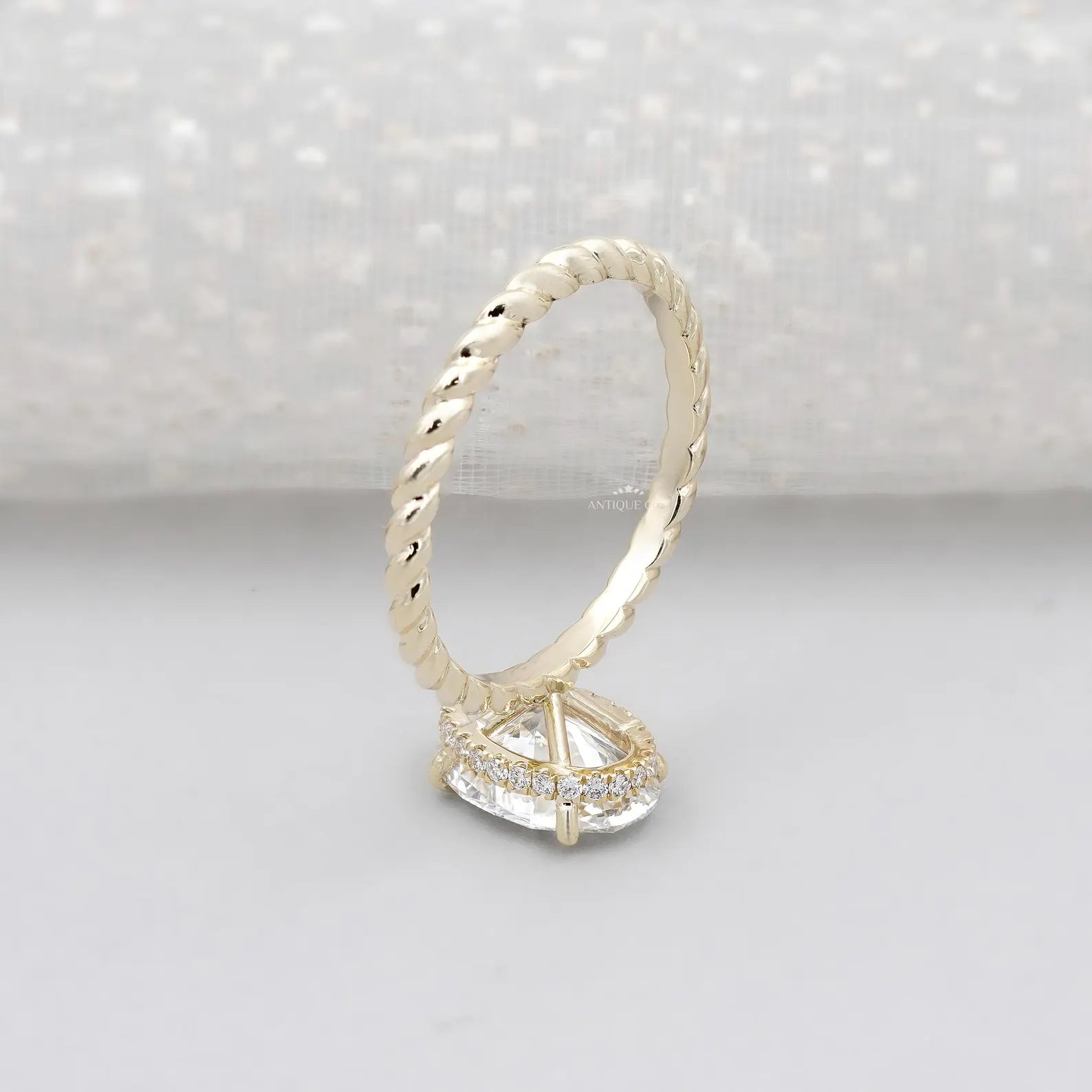 Hidden Halo Oval Cut Engagement Ring with Twisted Gold Band