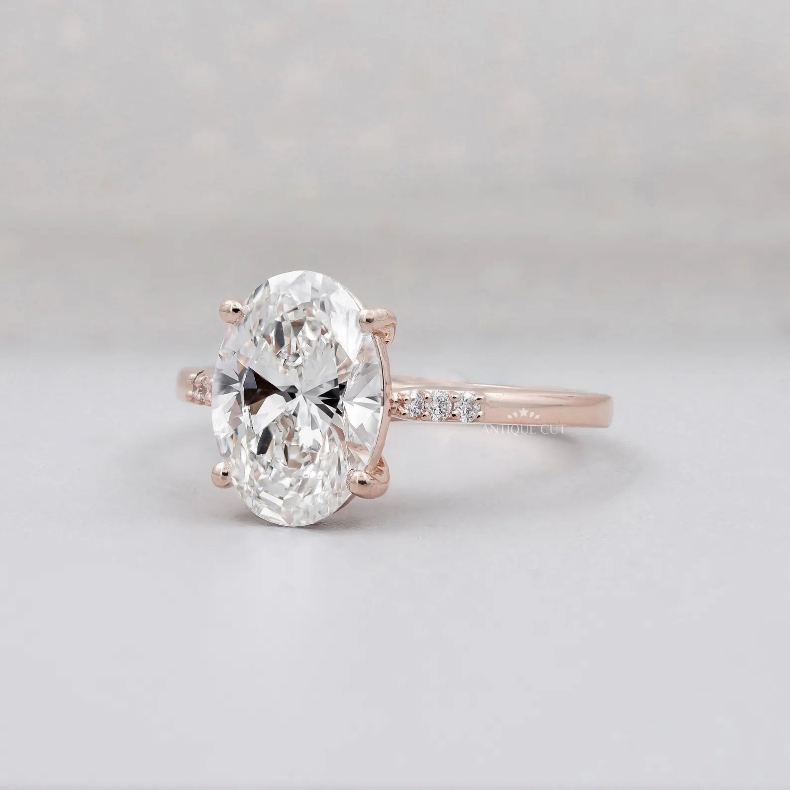 Oval lab grown diamond engagement ring with pavé setting