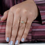 R letter yellow gold ring featuring a bezel set diamond