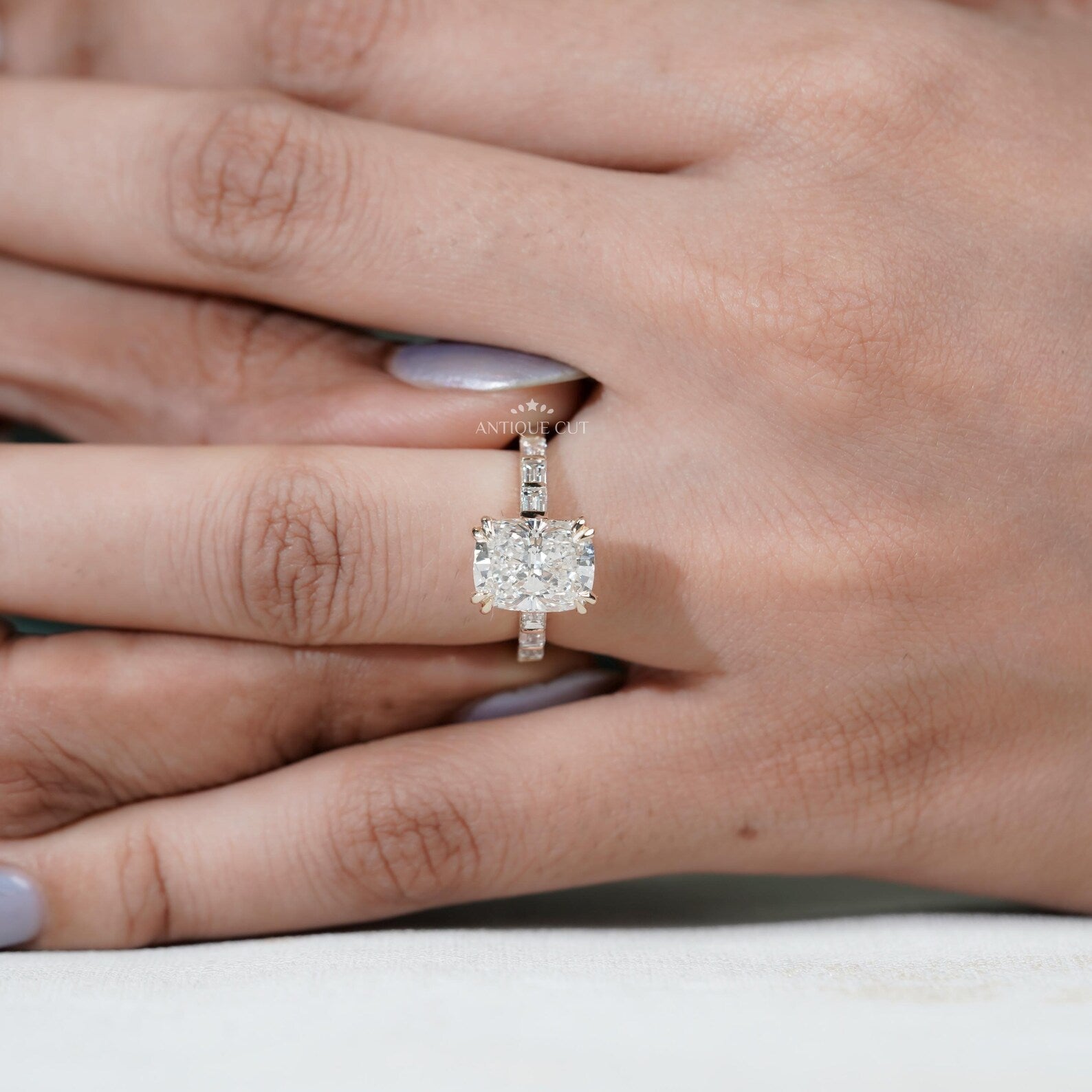 Lab grown diamond cushion engagement ring with pavé setting in yellow gold