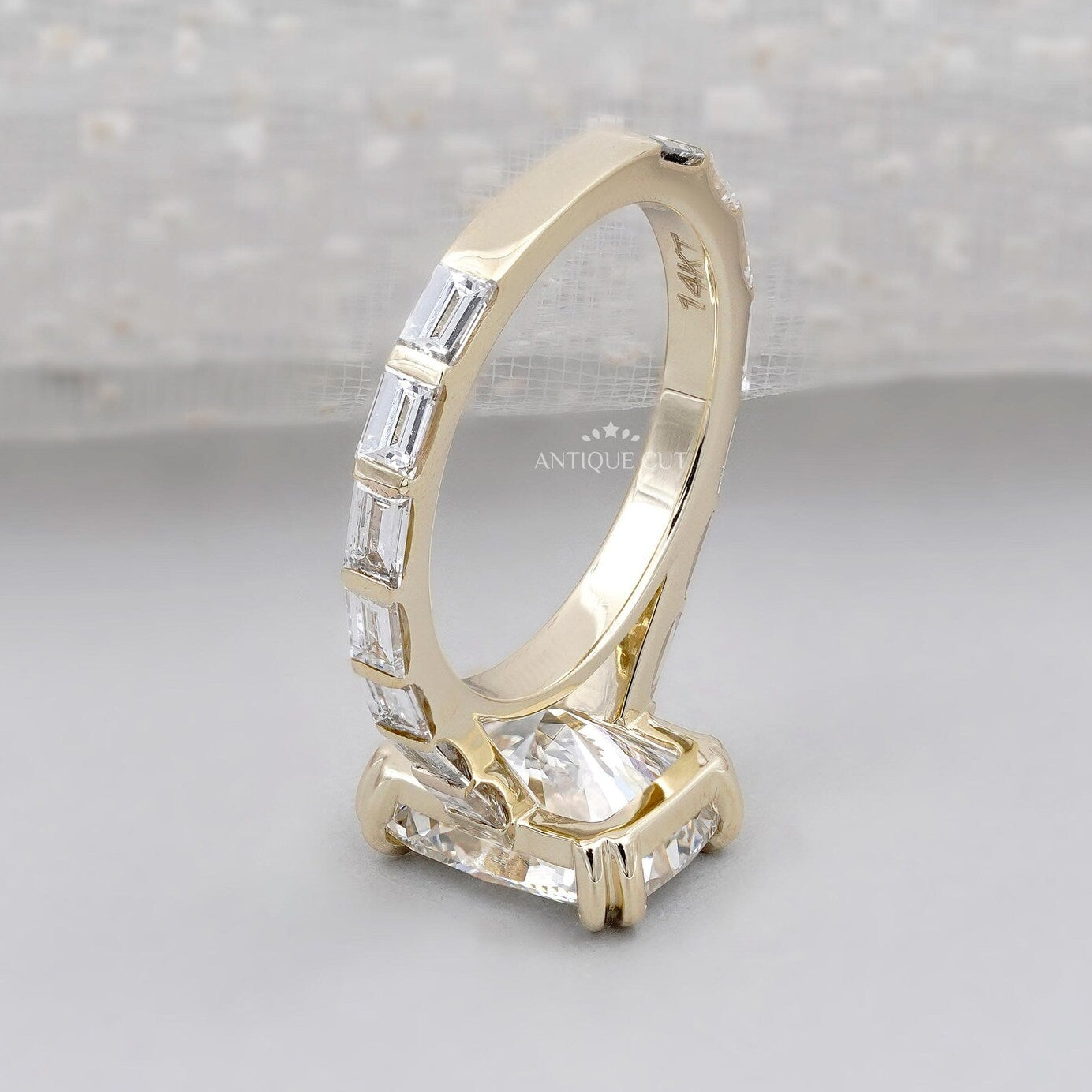Antiquecut cushion cut engagement ring with double claw prong and pavé band