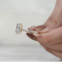 Yellow gold lab grown diamond engagement ring with radiant cut center and hidden halo