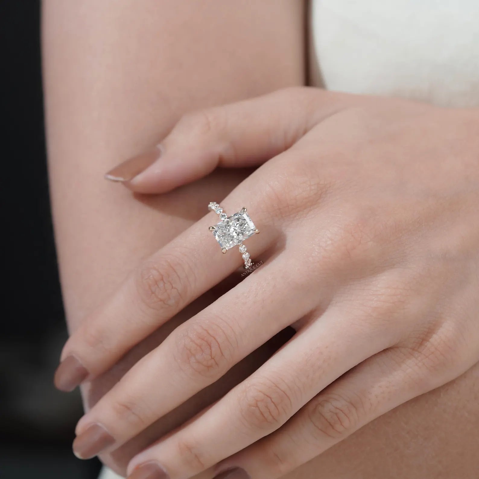 Radiant cut diamond engagement ring with hidden halo setting by Antiquecut