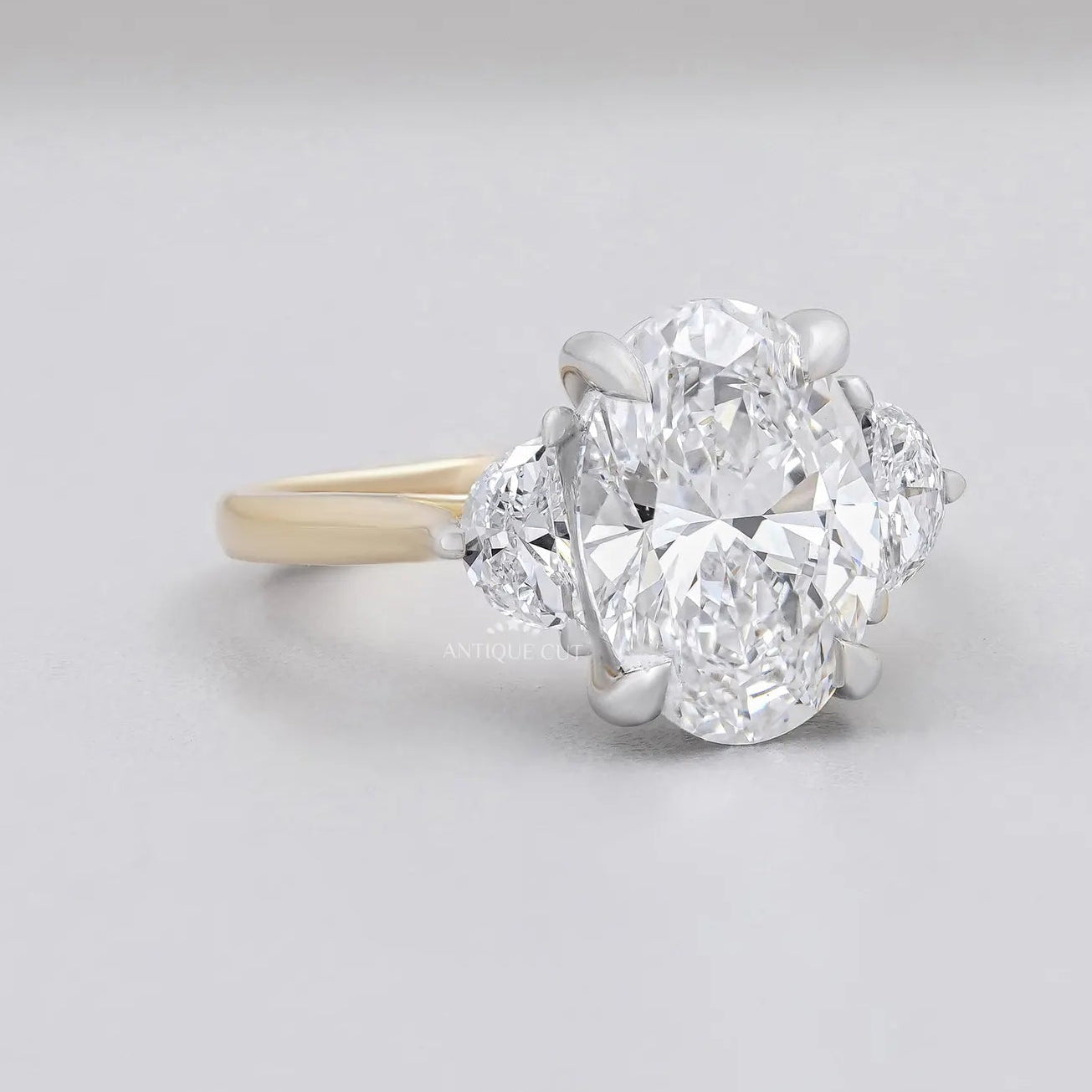 Oval Engagement Ring with Three Stone in Yellow Gold
