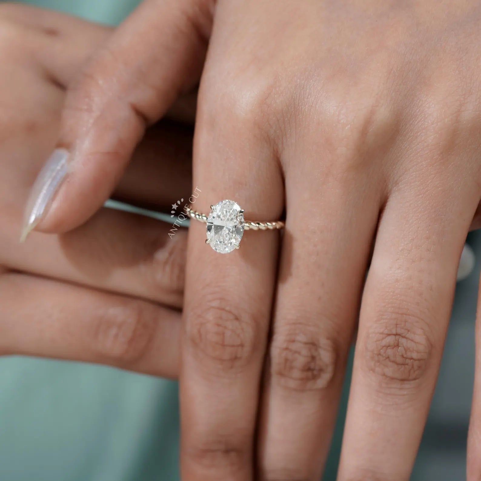 Hidden Halo Oval Cut Engagement Ring with Twisted Gold Band