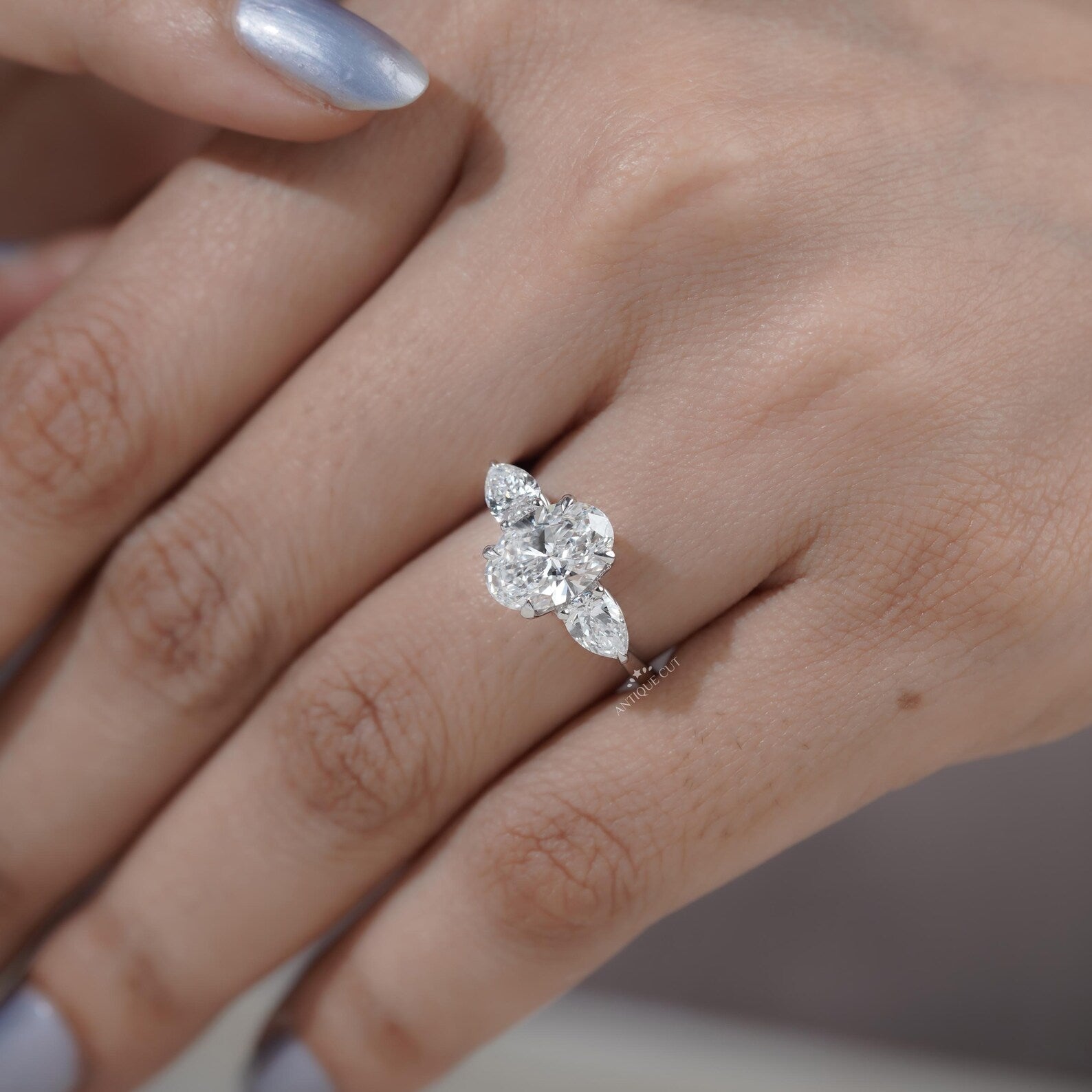 Three Stone Oval Cut Diamond Ring
