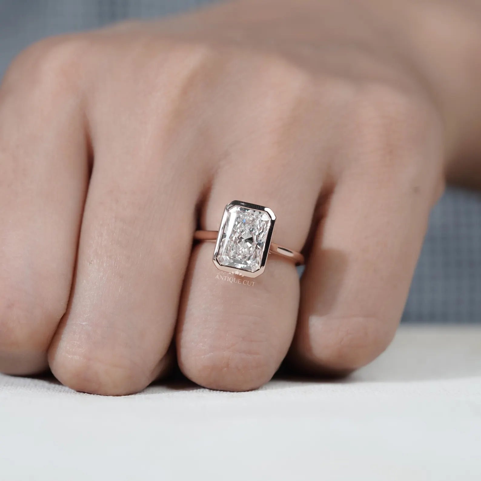 Radiant Cut Engagement Ring with Bezel Set Diamond