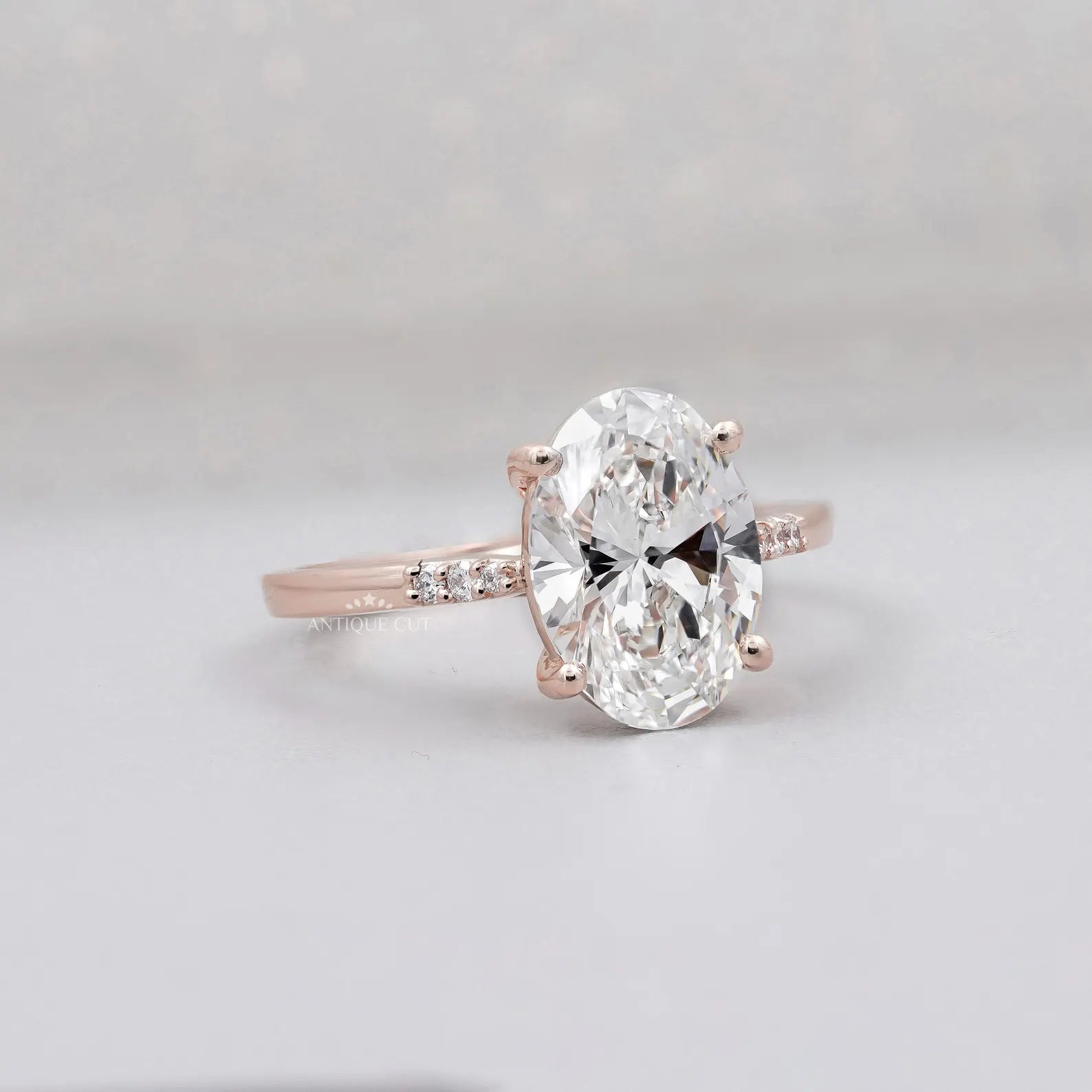 Rose gold oval diamond ring with cathedral setting