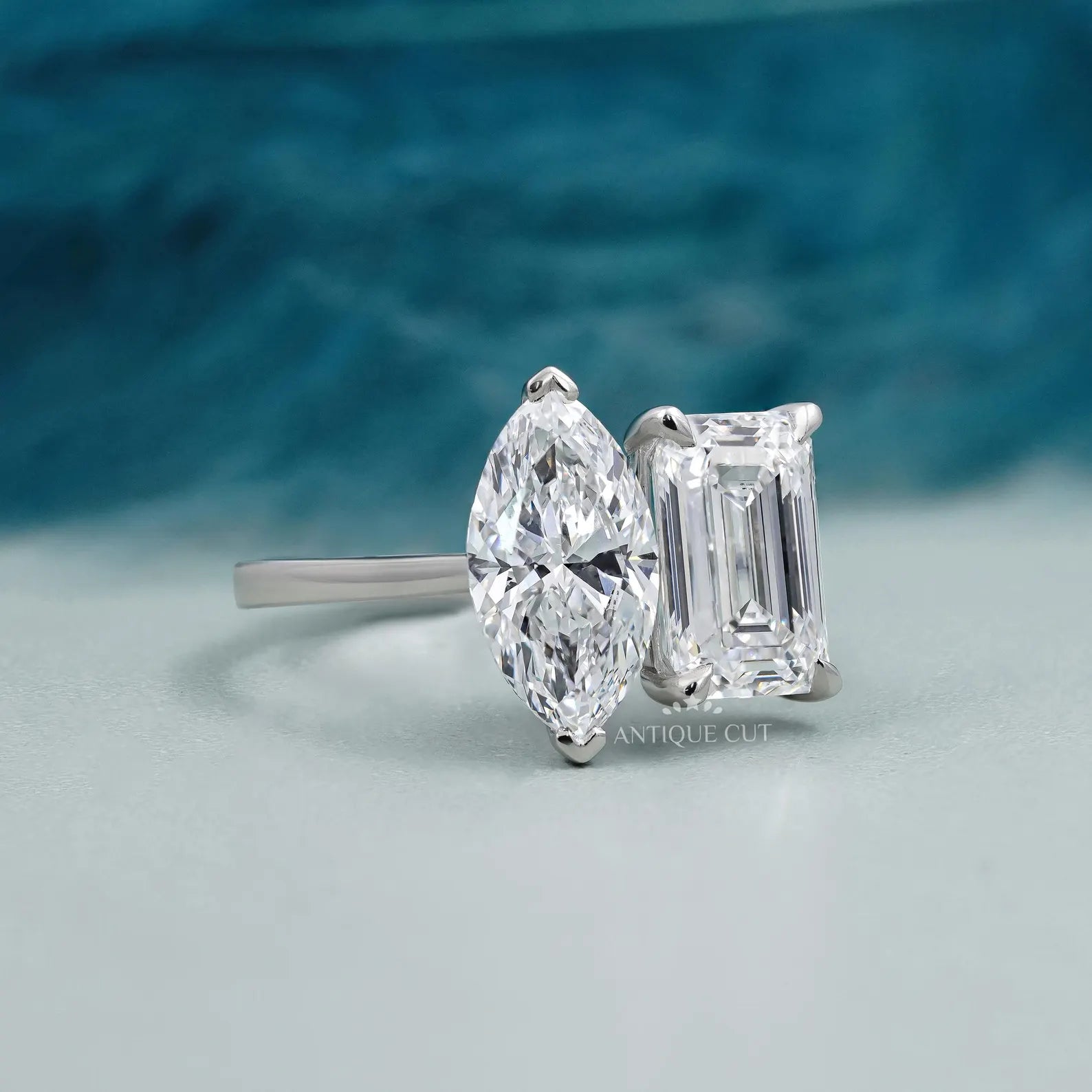 Emerald and Marquise Two stone Engagement Ring