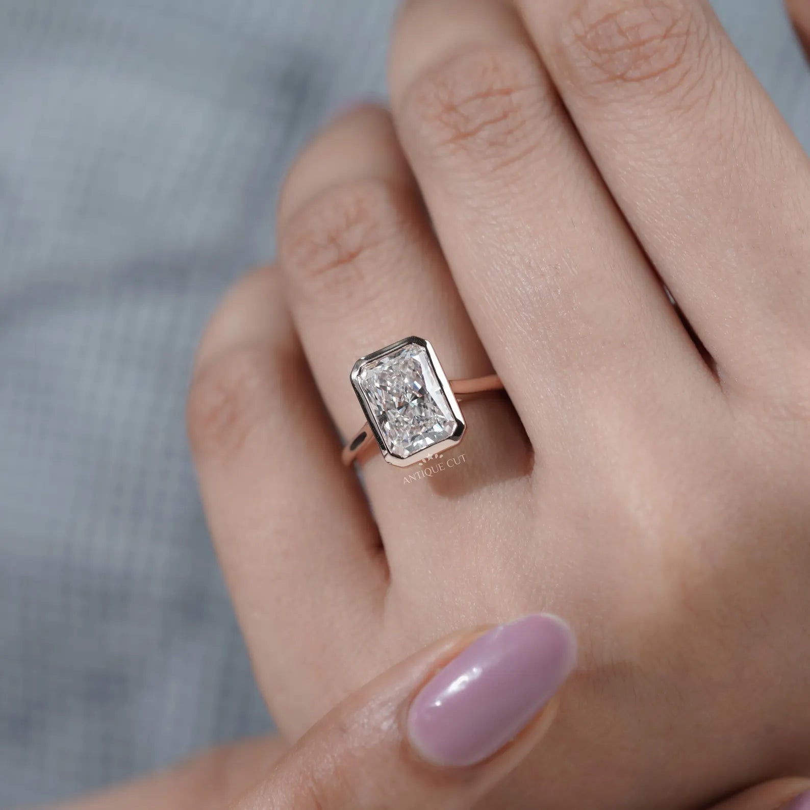 Radiant Cut Engagement Ring with Bezel Set Diamond