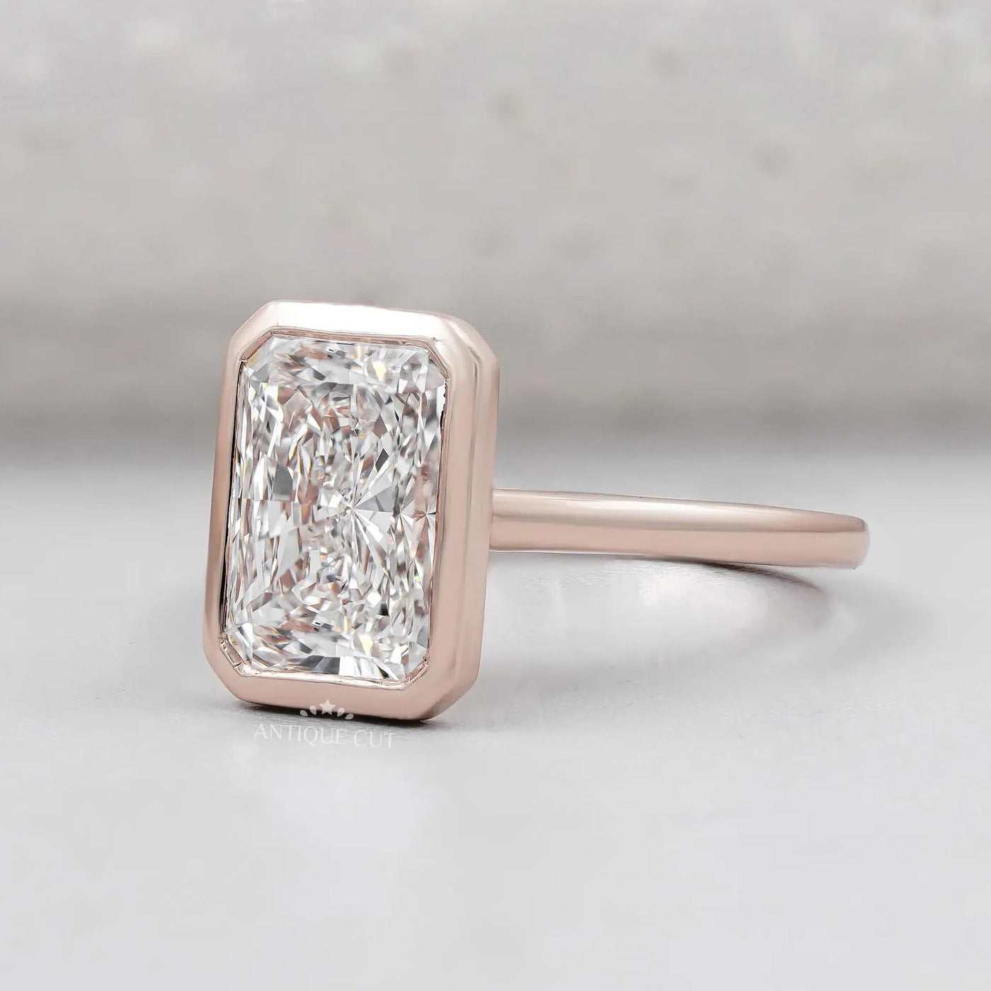 Radiant Cut Engagement Ring with Bezel Set Diamond