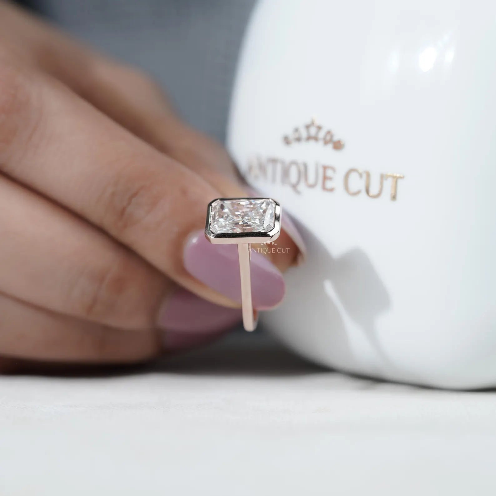 Radiant Cut Engagement Ring with Bezel Set Diamond