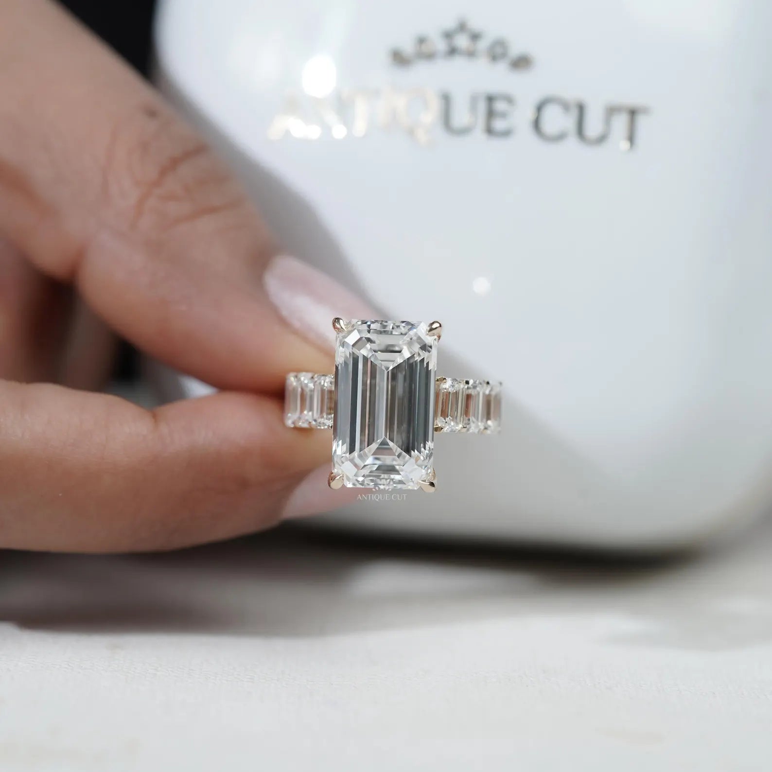 Emerald Cut Diamond Engagement Ring with Tapered Side Stones