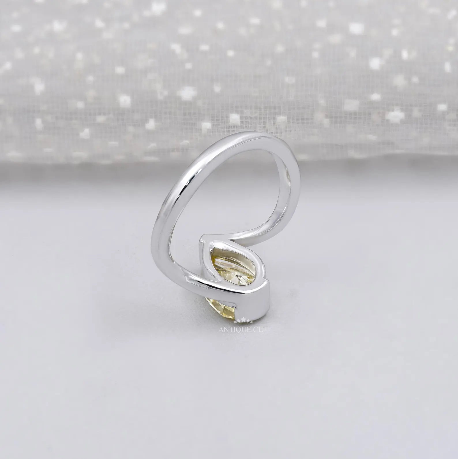 Yellow pear cut diamond wedding ring with IGI certified stone