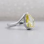 Fancy yellow pear diamond bypass engagement ring