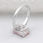 Lab grown pink diamond engagement ring with emerald cut center stone