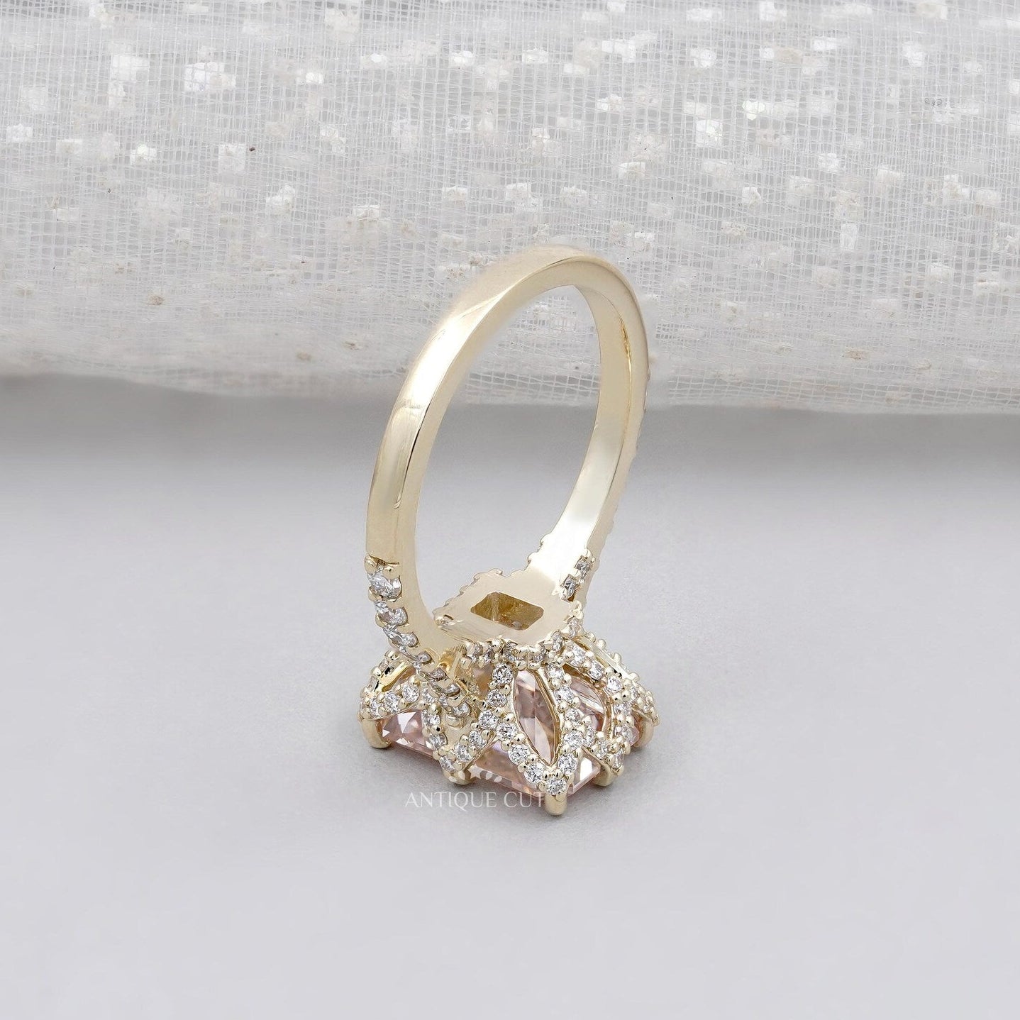 Elegant radiant pink diamond ring with hidden halo setting